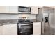 Kitchen view featuring stainless steel appliances and granite countertops at 16203 E 47Th Pl, Denver, CO 80239