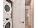Conveniently located laundry area with modern, stackable washer and dryer at 16203 E 47Th Pl, Denver, CO 80239