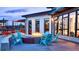 Inviting patio area with a fire pit and comfortable seating, perfect for outdoor gatherings and relaxation at 16203 E 47Th Pl, Denver, CO 80239