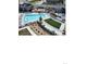 Aerial view of a well-maintained pool and lounging area, offering a refreshing and relaxing outdoor space at 16203 E 47Th Pl, Denver, CO 80239