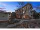 Evening view of the building exterior, showing landscaping and building details at 8422 S Upham Way # H61, Littleton, CO 80128