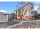 Brick building exterior with landscaping and walkway leading to the entrance at 8422 S Upham Way # H61, Littleton, CO 80128