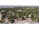 A wooded lot offers tranquility and privacy in this aerial view of the landscape with tree coverage at 7841 Deertrail Dr, Parker, CO 80138