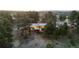 An aerial view of a charming home nestled among evergreen trees at 7841 Deertrail Dr, Parker, CO 80138
