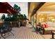 Beautiful back deck with patio furniture and views of the surrounding trees at 7841 Deertrail Dr, Parker, CO 80138
