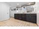 Bright bathroom features a double vanity with dark wood cabinets, granite counters and neutral tiled flooring at 7841 Deertrail Dr, Parker, CO 80138