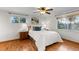 Bright bedroom with hardwood floors, large windows, and ample natural light at 7841 Deertrail Dr, Parker, CO 80138