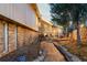 Exterior home shot with lovely landscaping and a protected by Brinks sign at 7841 Deertrail Dr, Parker, CO 80138