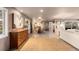 Spacious living room featuring tile floors, multiple windows, and elegant decor at 7841 Deertrail Dr, Parker, CO 80138