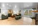 Spacious living room with hardwood floors, walkout to backyard, and brick fireplace at 7841 Deertrail Dr, Parker, CO 80138