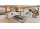 Open living room featuring two white sofas, light colored walls and carpet, and decorative artwork at 7841 Deertrail Dr, Parker, CO 80138