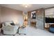 Comfortable living room with stone fireplace, plush seating, and stylish decor at 7841 Deertrail Dr, Parker, CO 80138