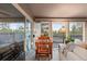 Bright sunroom with large windows and sliding glass doors leading to the outdoor deck at 7841 Deertrail Dr, Parker, CO 80138