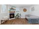 Bright living room features a cozy fireplace, stylish decor, and comfortable seating area at 760 W Asbury Ave, Denver, CO 80223