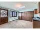 Bedroom with large closet, blue walls, door to exterior and utility sink with cabinet at 57 Scott S Dr, Broomfield, CO 80020