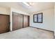 Carpeted bedroom with a large window with blinds and a closet with sliding doors at 57 Scott S, Broomfield, CO 80020