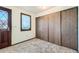 Bedroom featuring neutral carpet, a window and closet storage at 57 Scott S, Broomfield, CO 80020