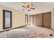 Bedroom featuring plush carpet, lots of natural light, and spacious closets at 57 Scott S, Broomfield, CO 80020