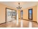 Dining area with hardwood floors, modern lighting, and sliding glass doors leading to another area at 57 Scott S Dr, Broomfield, CO 80020