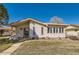 Charming single-story home featuring light siding, a covered porch, and well-maintained landscaping at 57 Scott S Dr, Broomfield, CO 80020