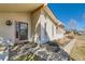 A charming home featuring light siding, a covered porch and meticulously maintained front yard landscaping at 57 Scott S, Broomfield, CO 80020