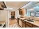 Kitchen featuring stainless steel appliances, skylight and a view into an adjacent living space at 57 Scott S, Broomfield, CO 80020