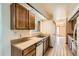 Functional kitchen featuring tile flooring, lots of counter space, and open to the dining room at 57 Scott S, Broomfield, CO 80020