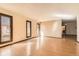 Open living room with hardwood floors, neutral paint, and bright light from the many windows at 57 Scott S, Broomfield, CO 80020