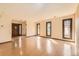 Bright living room featuring hardwood floors, large windows, and an open layout at 57 Scott S, Broomfield, CO 80020