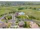 Aerial shot showcasing community pool, clubhouse, manicured green spaces and single-Gathering homes at 7380 S Shady Grove Way, Aurora, CO 80016