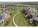 Aerial view of a neighborhood with a path surrounded by green space, creating a community feel at 7380 S Shady Grove Way, Aurora, CO 80016