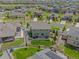 Aerial view of a home with green lawn and patio, set in a neighborhood with tree-lined streets at 7380 S Shady Grove Way, Aurora, CO 80016