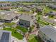 Aerial view of a home with green lawn and patio, set in a neighborhood with tree-lined streets at 7380 S Shady Grove Way, Aurora, CO 80016