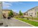 Well-maintained backyard with a patio, green lawn, and wooden fence for a private outdoor space at 7380 S Shady Grove Way, Aurora, CO 80016