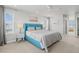 Bright and airy bedroom featuring a modern blue bed with light grey bedding and abundant natural light at 7380 S Shady Grove Way, Aurora, CO 80016