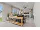 Open-concept living room with large windows, tile floors, a ceiling fan, and comfortable seating at 7380 S Shady Grove Way, Aurora, CO 80016