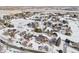 Aerial view of house and surrounding neighborhood in winter at 221 Mulligan Lake Dr, Mead, CO 80542