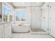 Spa-like bathroom with soaking tub and walk-in shower at 221 Mulligan Lake Dr, Mead, CO 80542