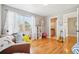 Cozy bedroom with hardwood floors and plenty of natural light at 221 Mulligan Lake Dr, Mead, CO 80542