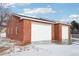 Spacious two-car brick garage with ample space at 221 Mulligan Lake Dr, Mead, CO 80542