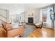 Bright living room with fireplace and hardwood floors at 221 Mulligan Lake Dr, Mead, CO 80542