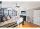 Spacious main bedroom with hardwood floors and large windows at 221 Mulligan Lake Dr, Mead, CO 80542