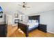 Main bedroom with hardwood floors and fireplace at 221 Mulligan Lake Dr, Mead, CO 80542