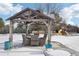 Backyard patio features a gazebo with seating for dining al fresco at 221 Mulligan Lake Dr, Mead, CO 80542