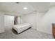 Finished basement featuring neutral carpet, a bed and direct access to a staircase at 2252 S Yosemite Cir, Denver, CO 80231