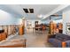 Unfinished basement space with vintage arcade game and concrete floor at 2252 S Yosemite Cir, Denver, CO 80231