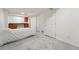 Finished basement featuring neutral carpet, a kitchenette and ample storage at 2252 S Yosemite Cir, Denver, CO 80231