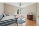 Charming bedroom with natural light, a comfy bed, and vintage dresser at 2252 S Yosemite Cir, Denver, CO 80231
