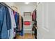 Walk-in closet features clothing racks and shelving for storage at 2252 S Yosemite Cir, Denver, CO 80231