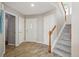 Entryway with wood floors and stairs leading to the second floor at 2252 S Yosemite Cir, Denver, CO 80231